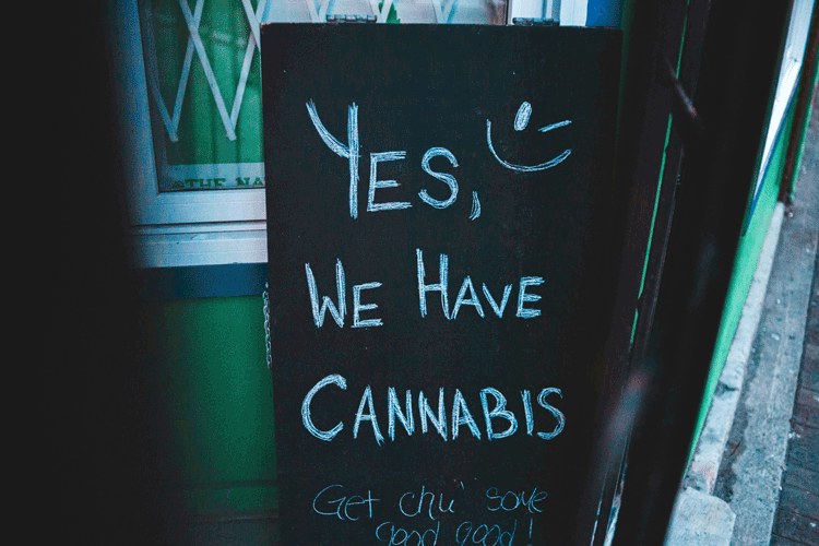 chalk sign with words 'yes we have cannabis'